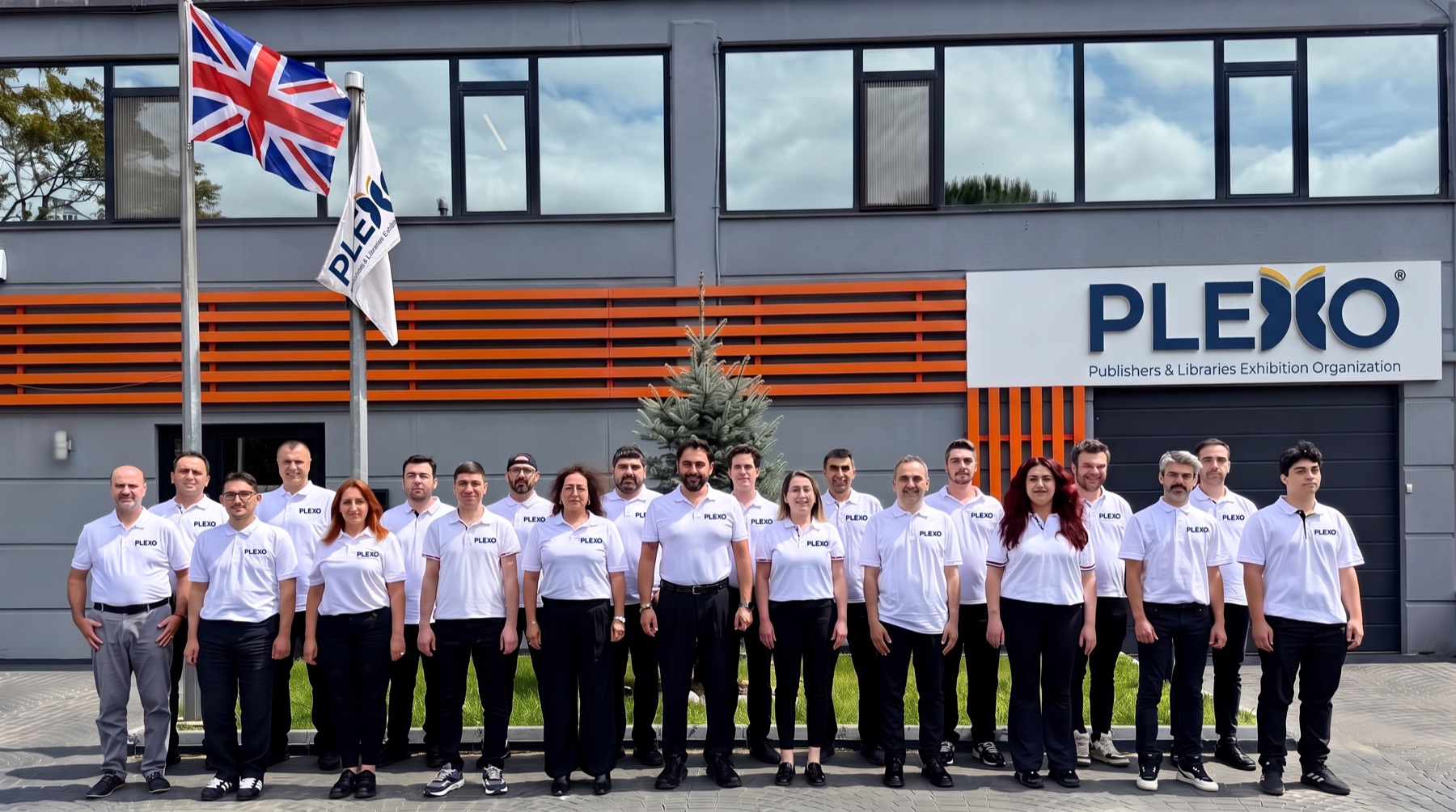 The PLEXO team assembled outside the organisation's offices.